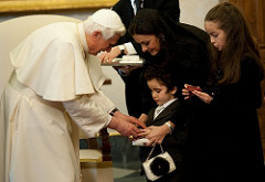 His Holiness Pope Benedict XVI gives a gift to Rafik Junior, last son of Lebanese Prime Minister Saad Hariri