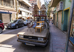 Chairs displayed on an old car in Basta antiques district, Beirut Governorate, Beirut, Lebanon