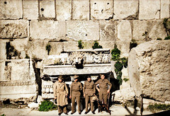 November 1942 - Allied troops in front of one of the great "Temple of Jupiter" frieze and cornice pieces with a "Lion Head" water spout gargoyle, Baalbek, Syria [now North Lebanon][colourized version]