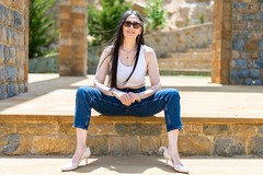 Woman sitting on a rock base